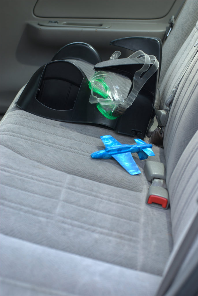 how to use a dslr camera booster seat in back of car with swimming goggles and toy plane