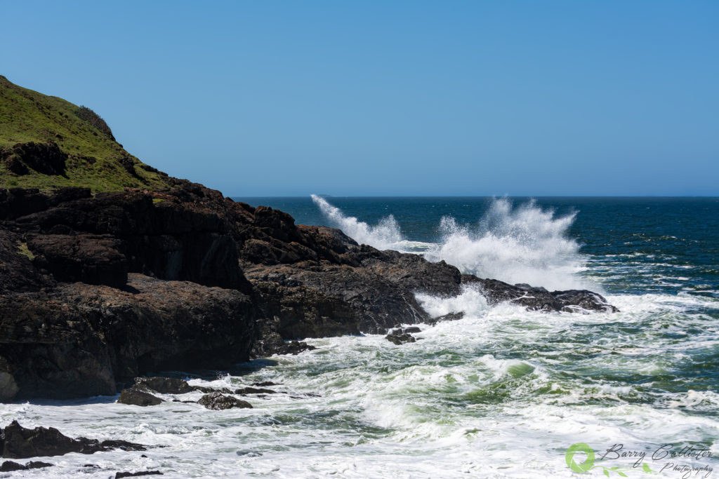 photo of the month for February 2020 waves crashing on rocks along coastline