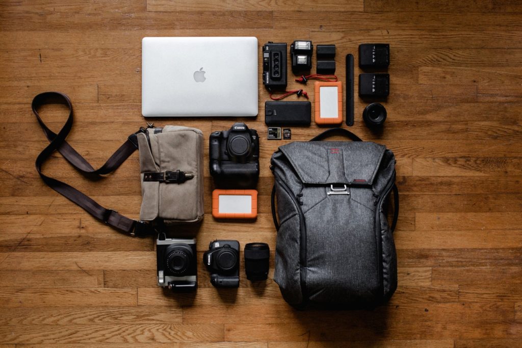 photography gear laid out on a timber floor